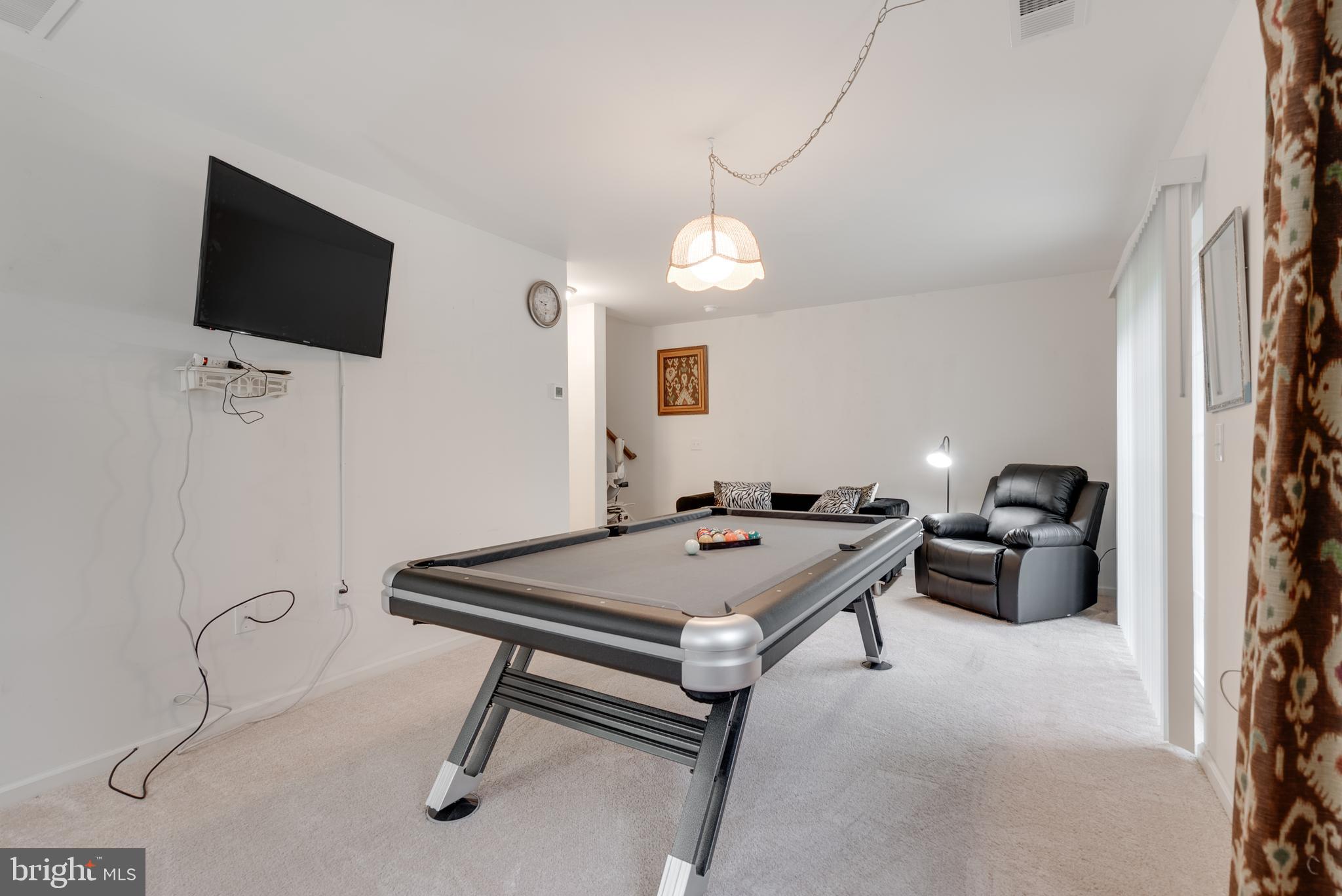 49 Creekside Way Burlington, NJ 08016 - Photo 22 of 25 a room with furniture and a flat screen tv