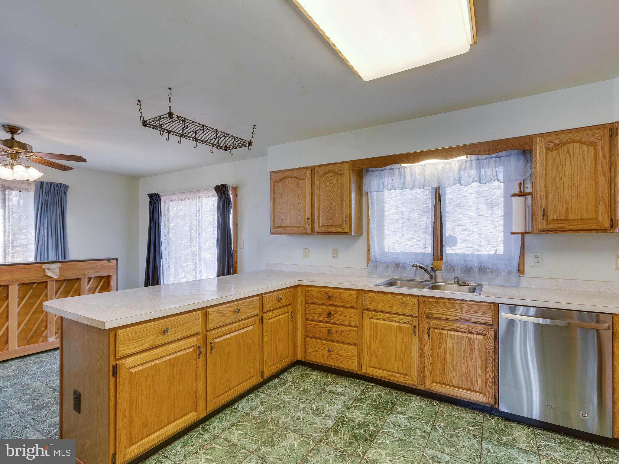 1897 Ridge Road Haymarket, VA 20169 - Photo 13 of 30 a kitchen with sink cabinets and window