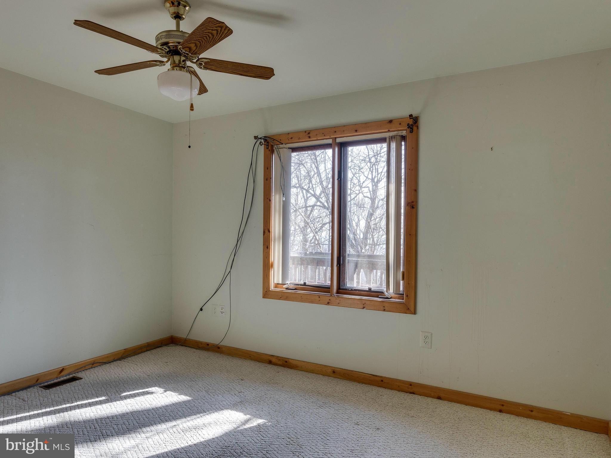 1897 Ridge Road Haymarket, VA 20169 - Photo 20 of 30 an empty room with windows and fan