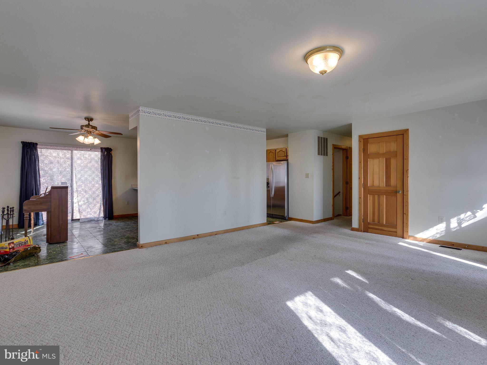 1897 Ridge Road Haymarket, VA 20169 - Photo 8 of 30 a view of a livingroom with a staircase