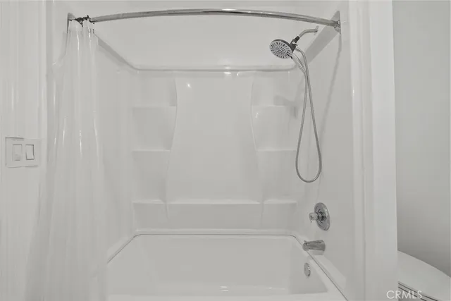 a close up view of a bathtub in bathroom
