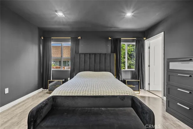 a bed sitting in a room next to a window