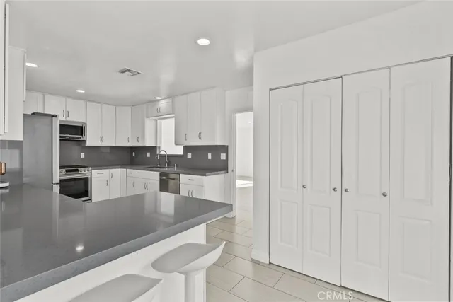 a large kitchen with cabinets