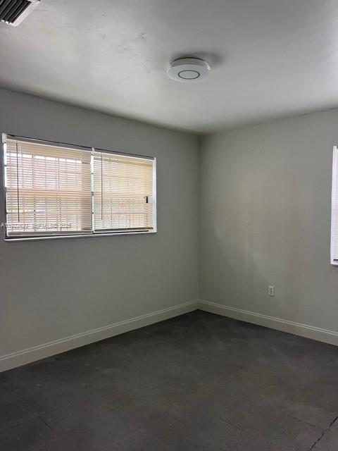 3310 Northwest 4th Street Miami, FL 33125 - Photo 7 of 9 an empty room with a window