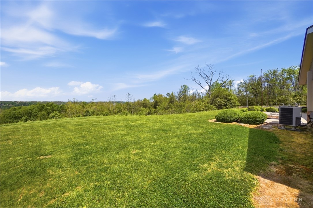 5669 O Neall Road Waynesville, OH 45068 - Photo 48 of 72 Expansive green yard with scenic views and vibrant shrubbery awaits.