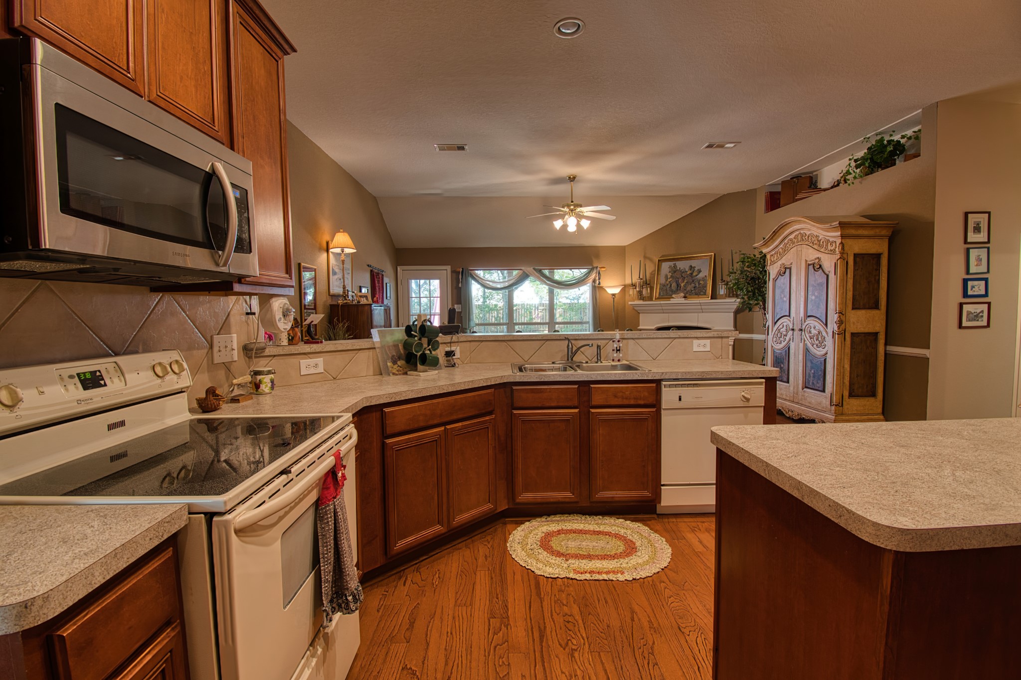 225 Mesa View Montgomery, TX 77316 - Photo 11 of 37 a kitchen that has a sink and a stove in it