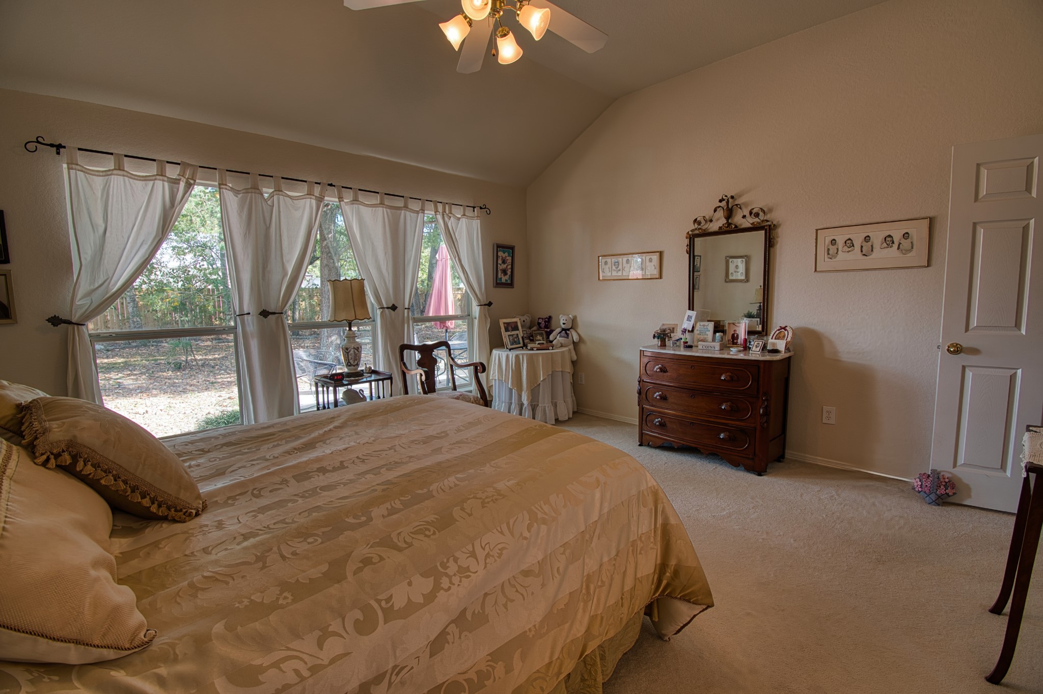 225 Mesa View Montgomery, TX 77316 - Photo 23 of 37 a bedroom with a bed dresser and a large window
