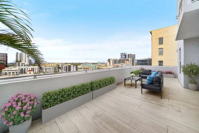 a view of a terrace with couches and lounge chair