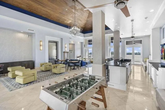 a living room with lots of furniture and a table