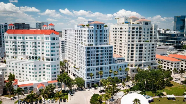 a multi story building with glass windows