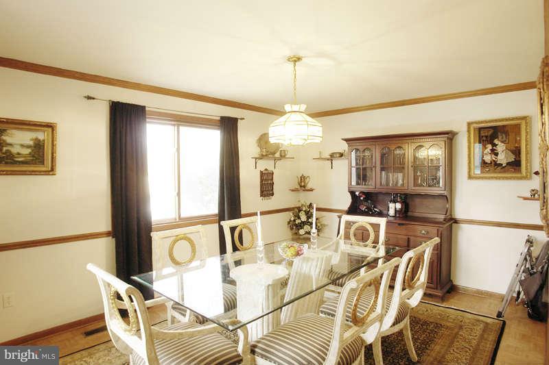 9505 Stewartown Road Gaithersburg, MD 20879 - Photo 7 of 30 Dining Room has crown & chair rail moldings