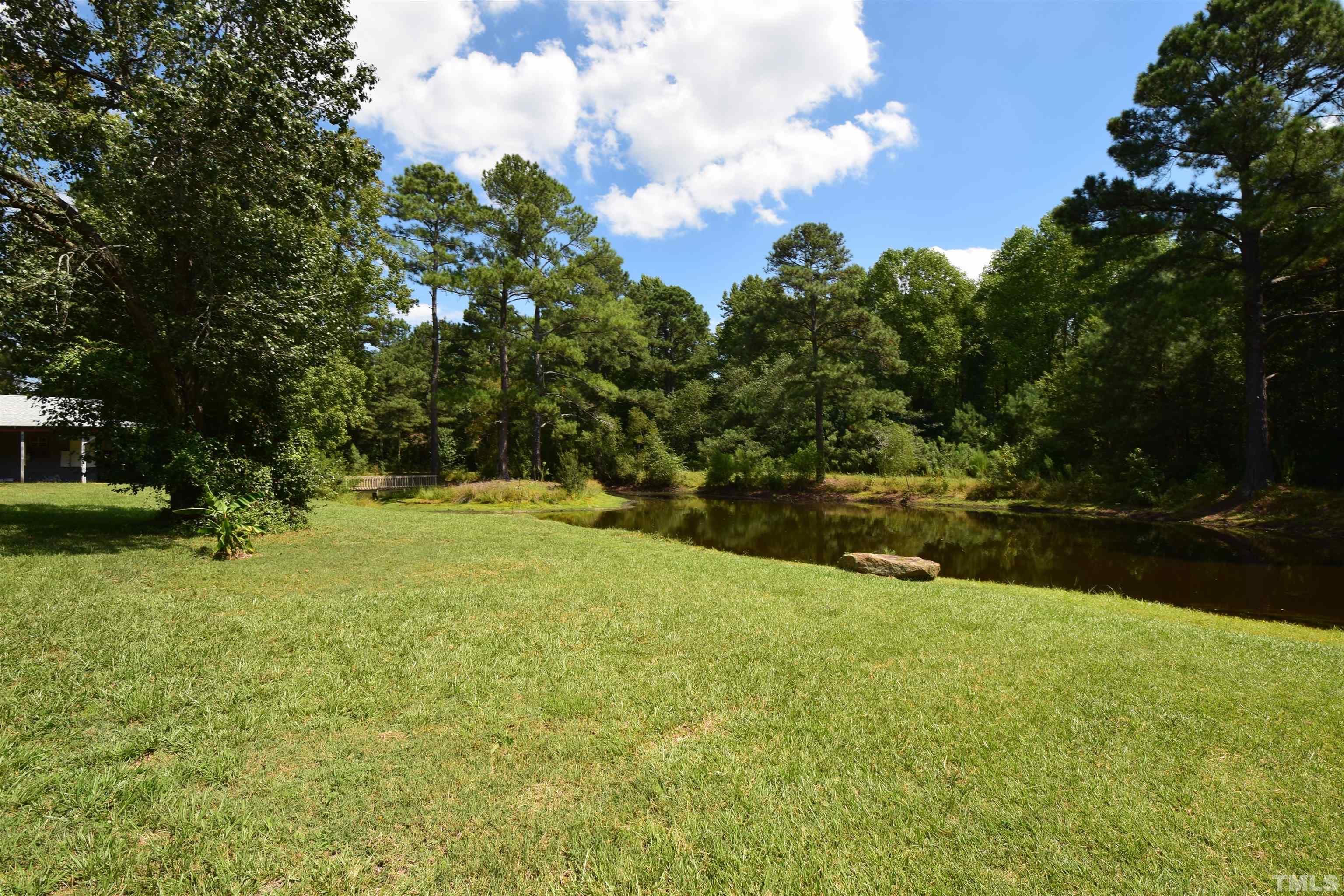 464 Young Road Angier, NC 27501 - Photo 2 of 3 a view of swimming pool and lake