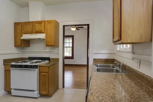 a kitchen with a stove and a sink