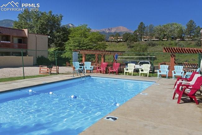 1018 Fontmore Road, Unit C Colorado Springs, CO 80904 - Photo 33 of 33 a view of a swimming pool with a patio