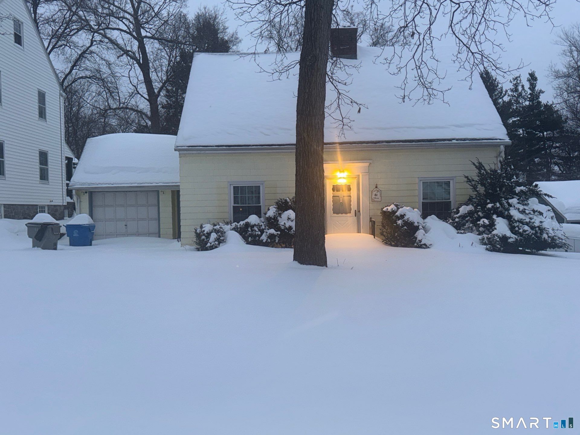a view of a chair and tables in the patio