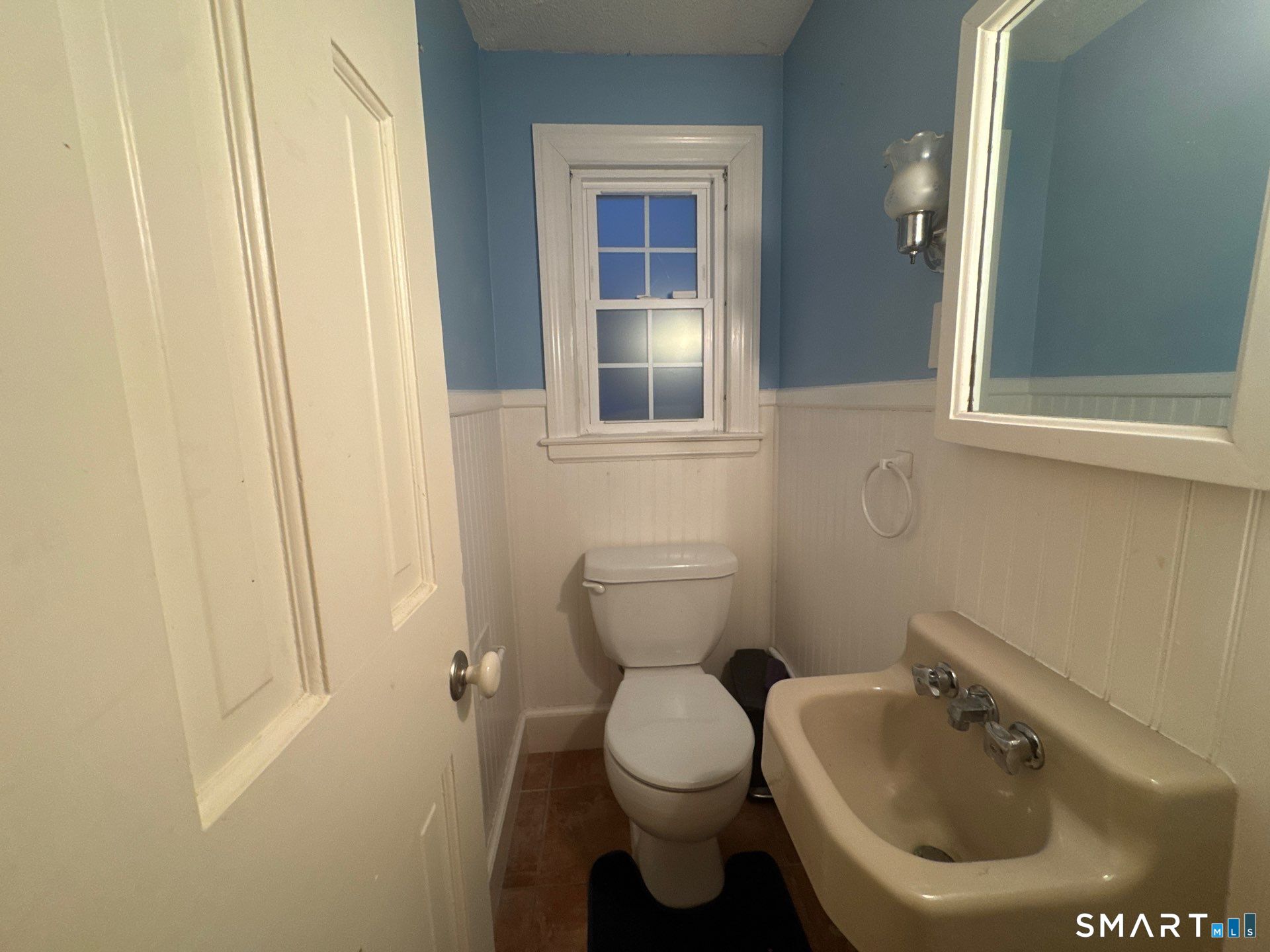 81 Lancaster Road Bristol, CT 06010 - Photo 20 of 30 a bathroom with a toilet sink and mirror