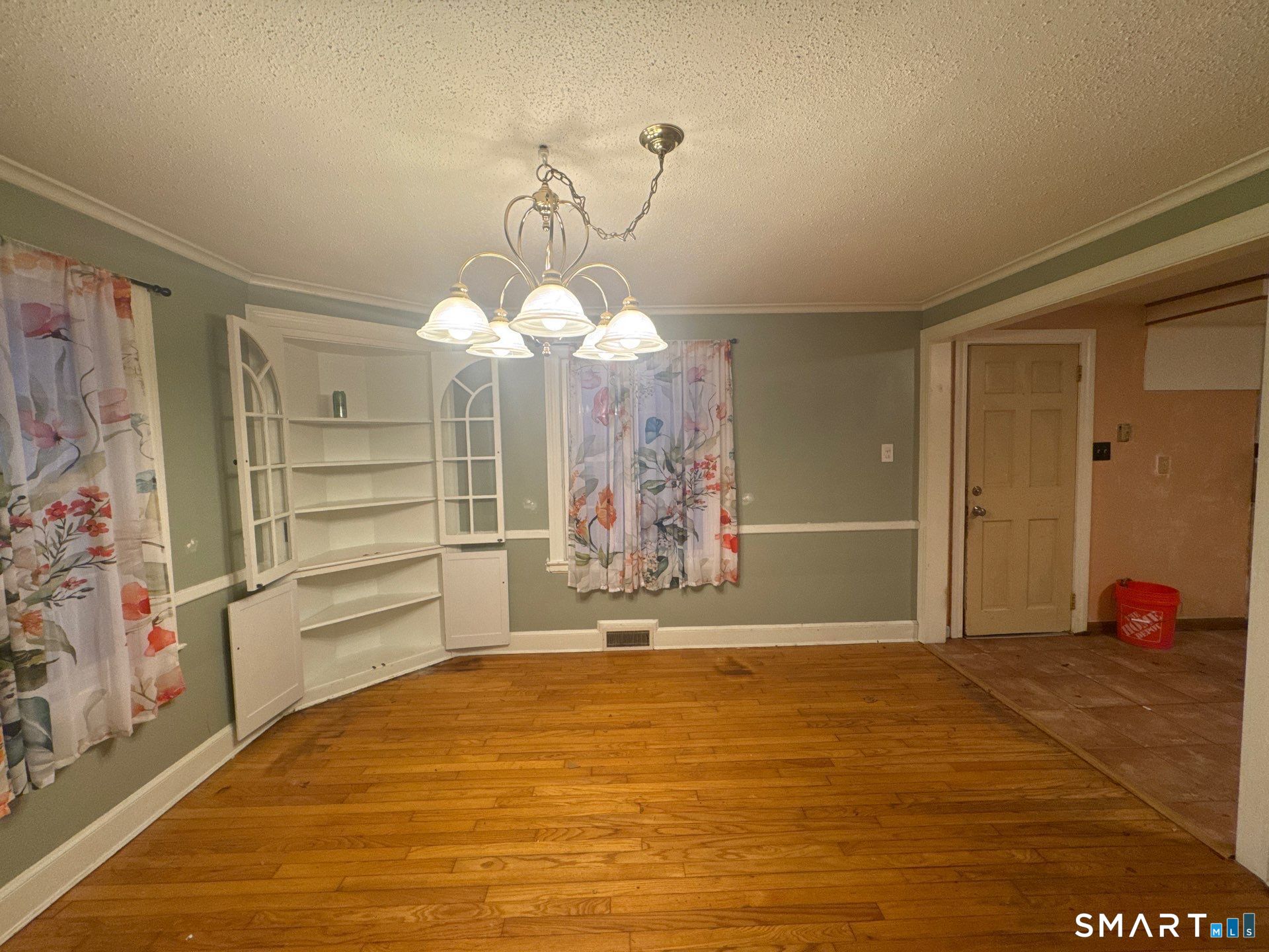 81 Lancaster Road Bristol, CT 06010 - Photo 4 of 30 a view of a livingroom with wooden floor and entryway