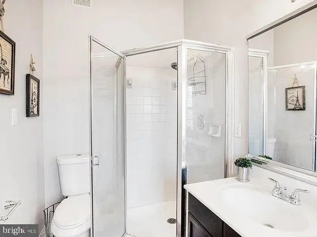 a view of a brick building next to a yard