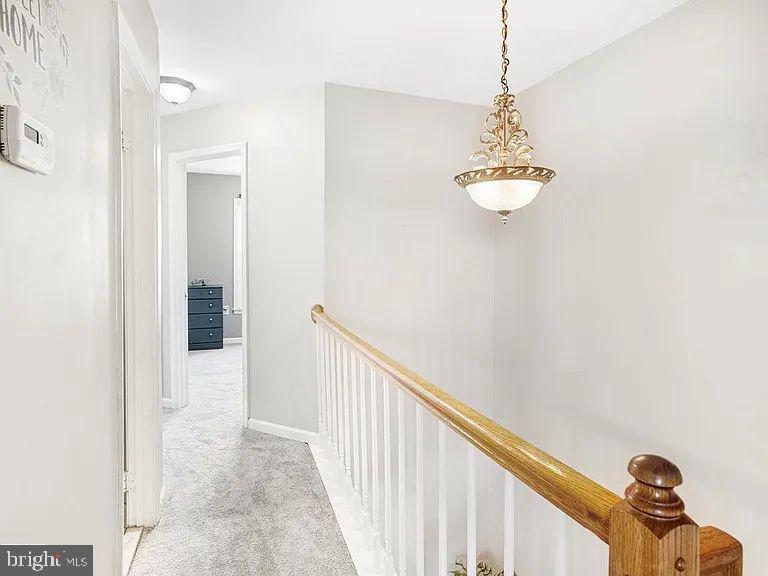10864 Caraway Circle Manassas, VA 20109 - Photo 9 of 16 a view of a hallway with chandelier and entryway