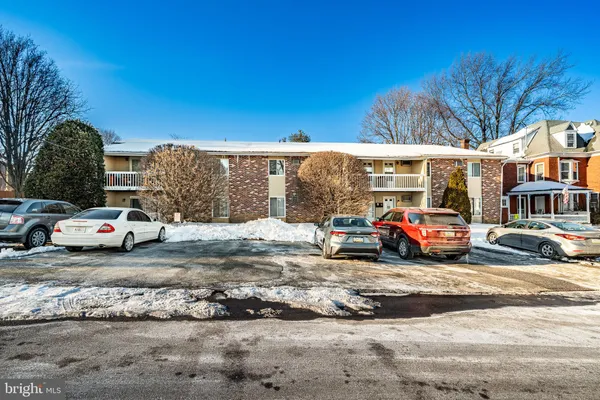 a view of street with parked cars