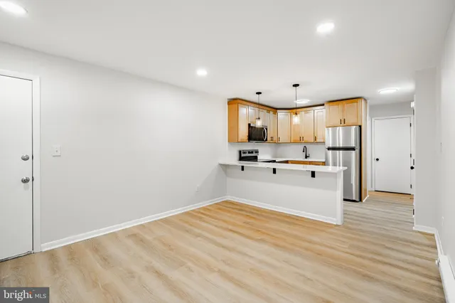 a view of kitchen with wooden floor