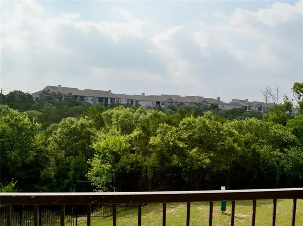 an aerial view of a house with a yard and outdoor seating
