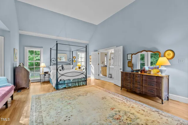a bathroom with a granite countertop sink a toilet and a mirror