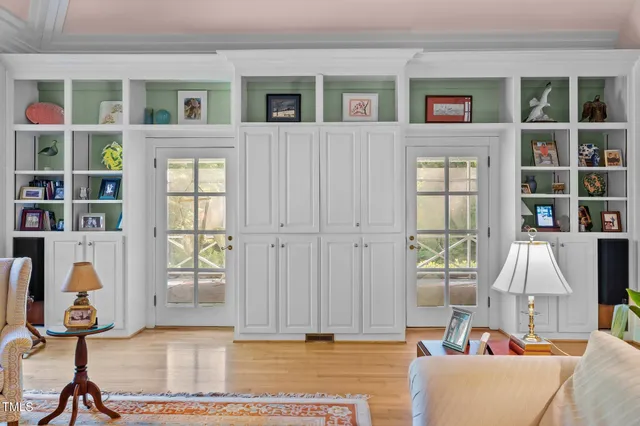 a living room filled with furniture and a window