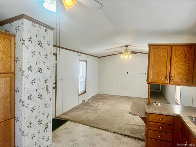 a view of a livingroom with wooden floor and cabinet