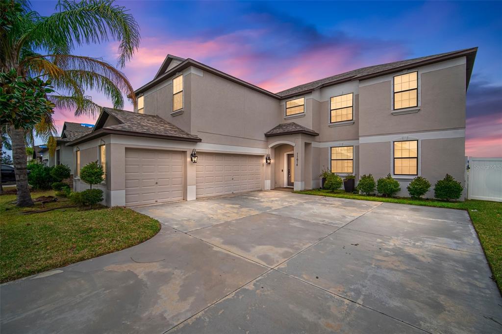 11614 Brighton Knoll Loop Riverview, FL 33579 - Photo 1 of 1 a front view of a house with a yard and garage
