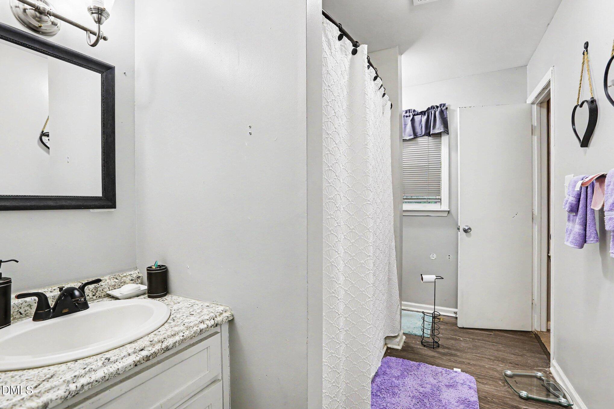 479 Ridgecrest Trail Henderson, NC 27537 - Photo 26 of 30 a bathroom with a sink and a mirror