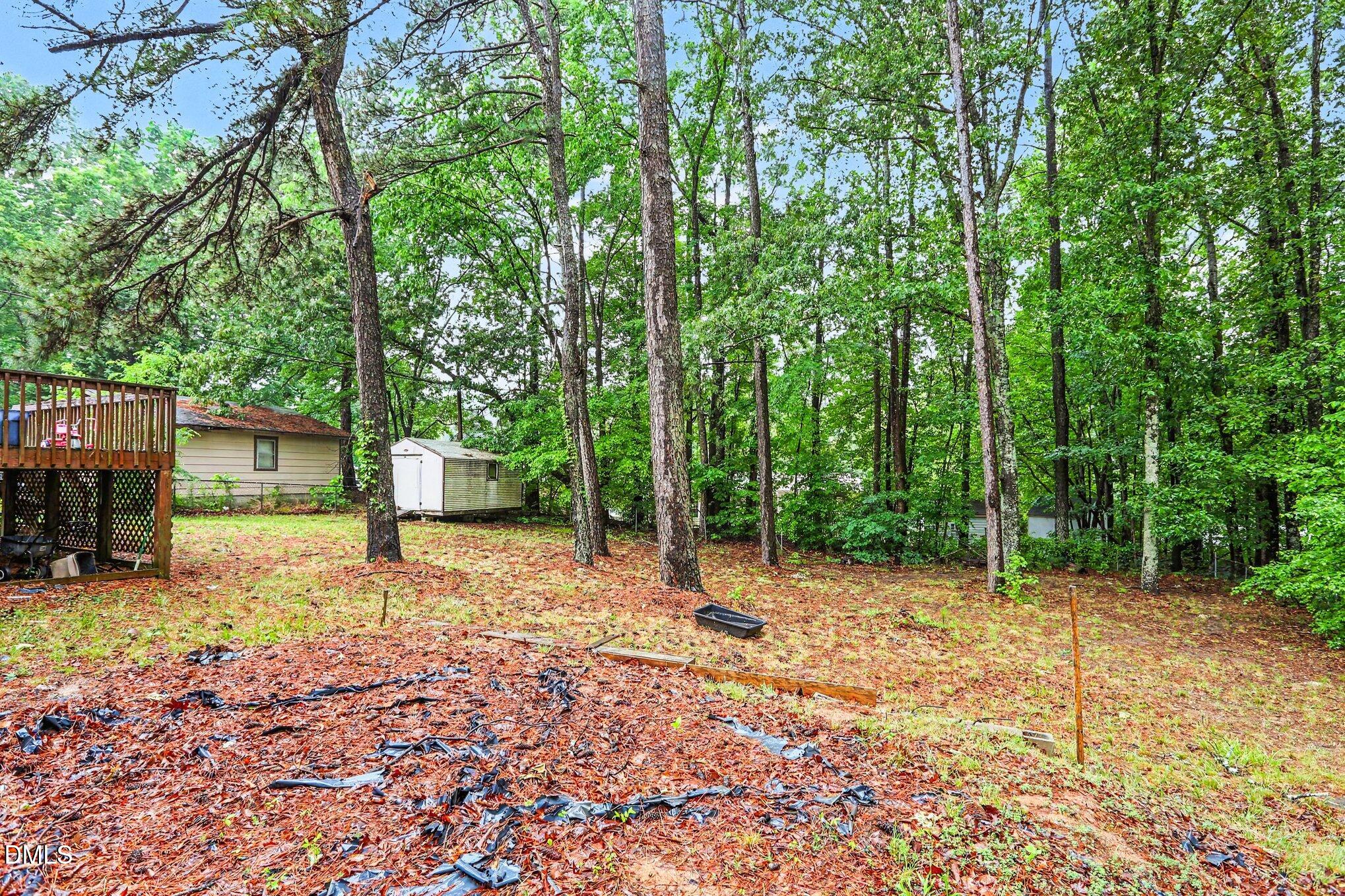 479 Ridgecrest Trail Henderson, NC 27537 - Photo 29 of 30 a backyard of a house with barbeque oven