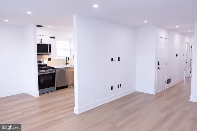a view of kitchen with wooden floor
