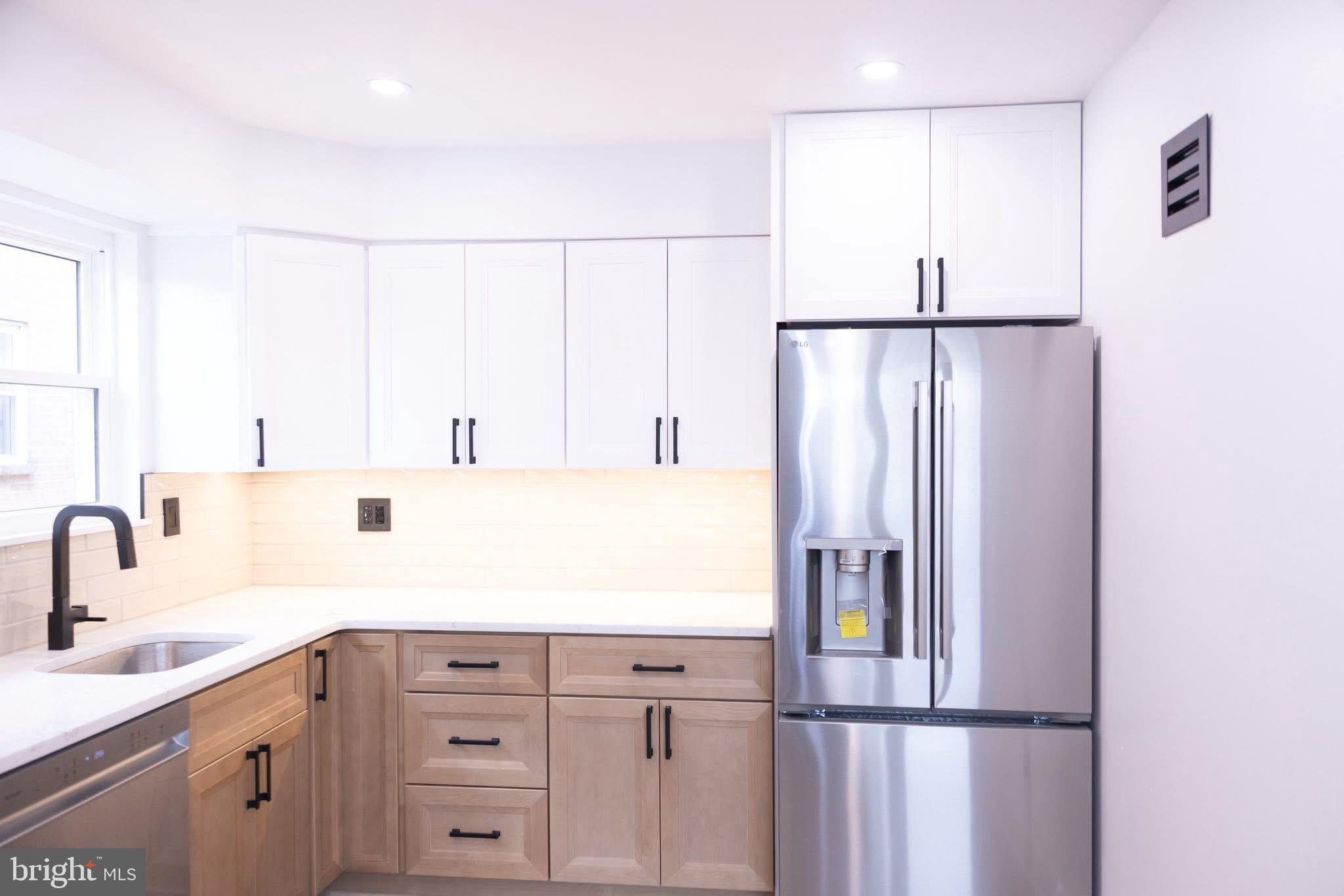 1969 Ambassador Street Philadelphia, PA 19115 - Photo 5 of 11 a kitchen with cabinets and stainless steel appliances