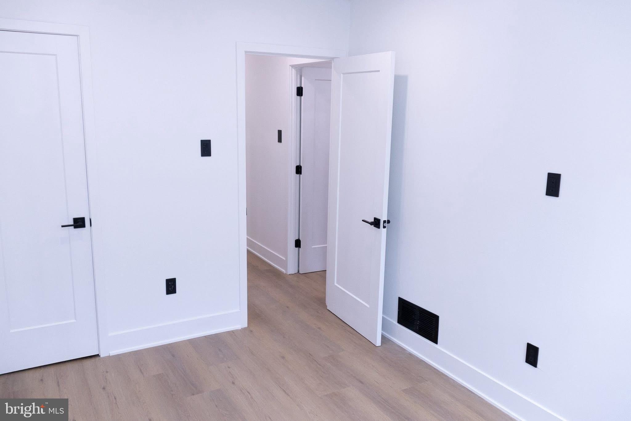 1969 Ambassador Street Philadelphia, PA 19115 - Photo 8 of 11 a view of a hallway with wooden floor