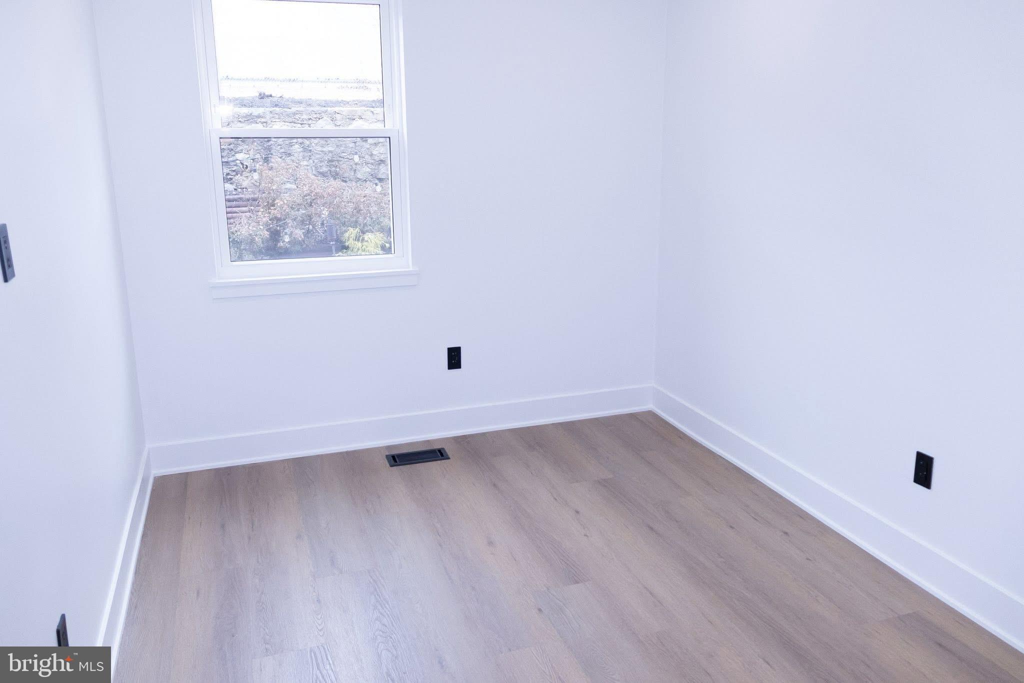 1969 Ambassador Street Philadelphia, PA 19115 - Photo 9 of 11 an empty room with a window