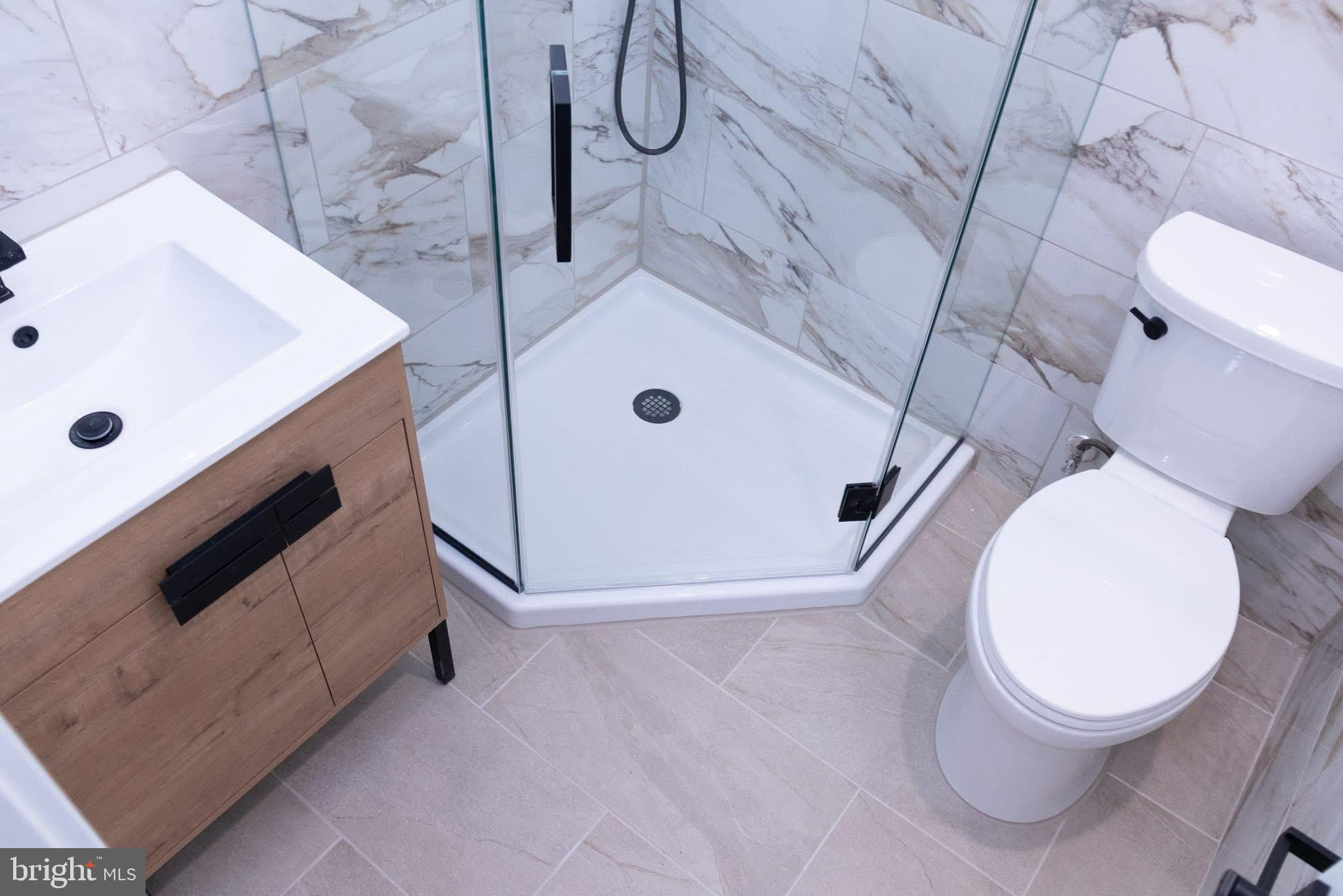 1969 Ambassador Street Philadelphia, PA 19115 - Photo 10 of 11 a bathroom with a sink a toilet and shower