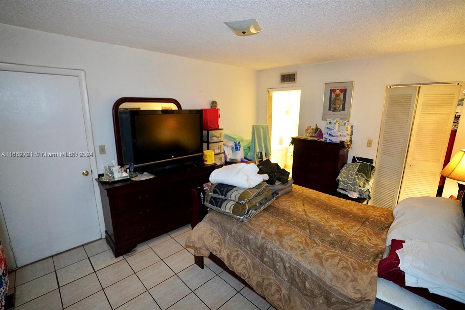 11790 Southwest 18th Street, Unit 2273 Miami, FL 33175 - Photo 11 of 18 a living room with furniture and a flat screen tv