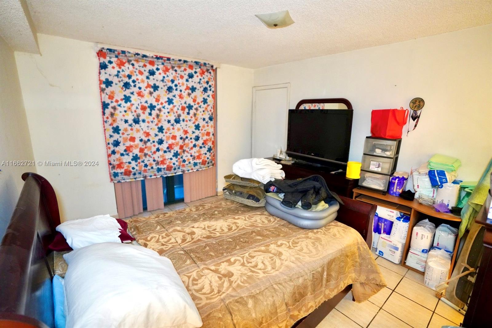 11790 Southwest 18th Street, Unit 2273 Miami, FL 33175 - Photo 12 of 18 a bedroom with a bed and dresser
