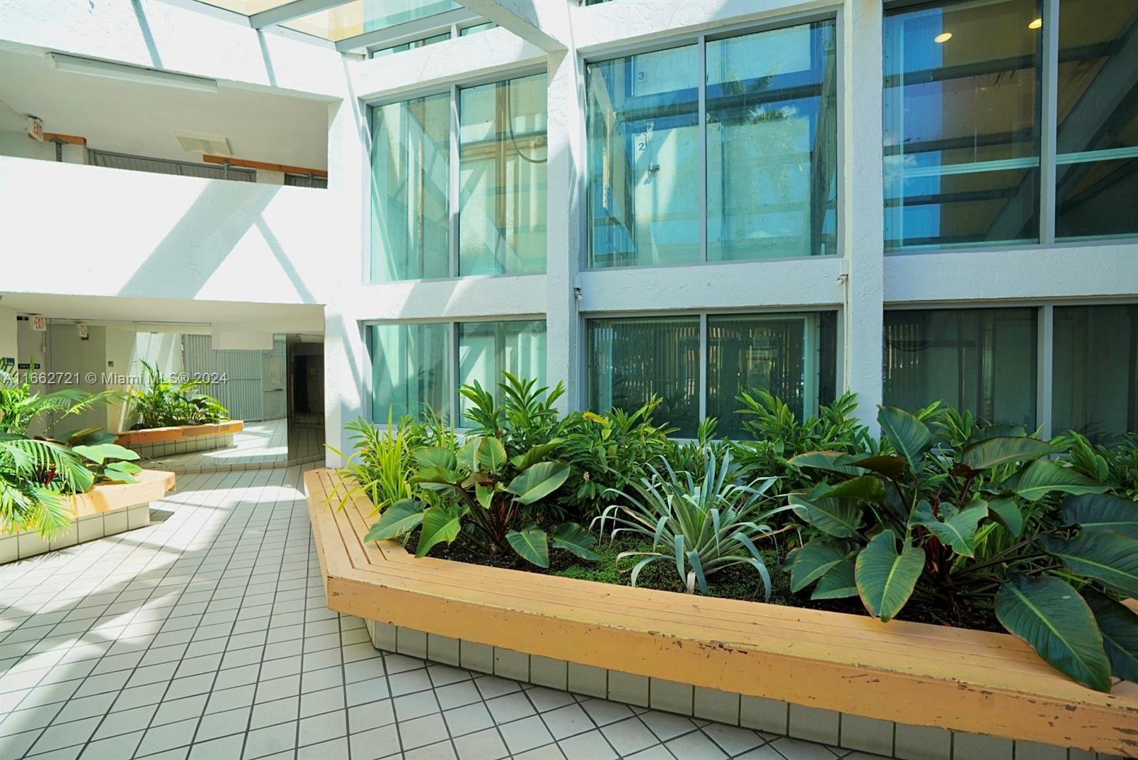 11790 Southwest 18th Street, Unit 2273 Miami, FL 33175 - Photo 3 of 18 a potted plant sitting in front of a house