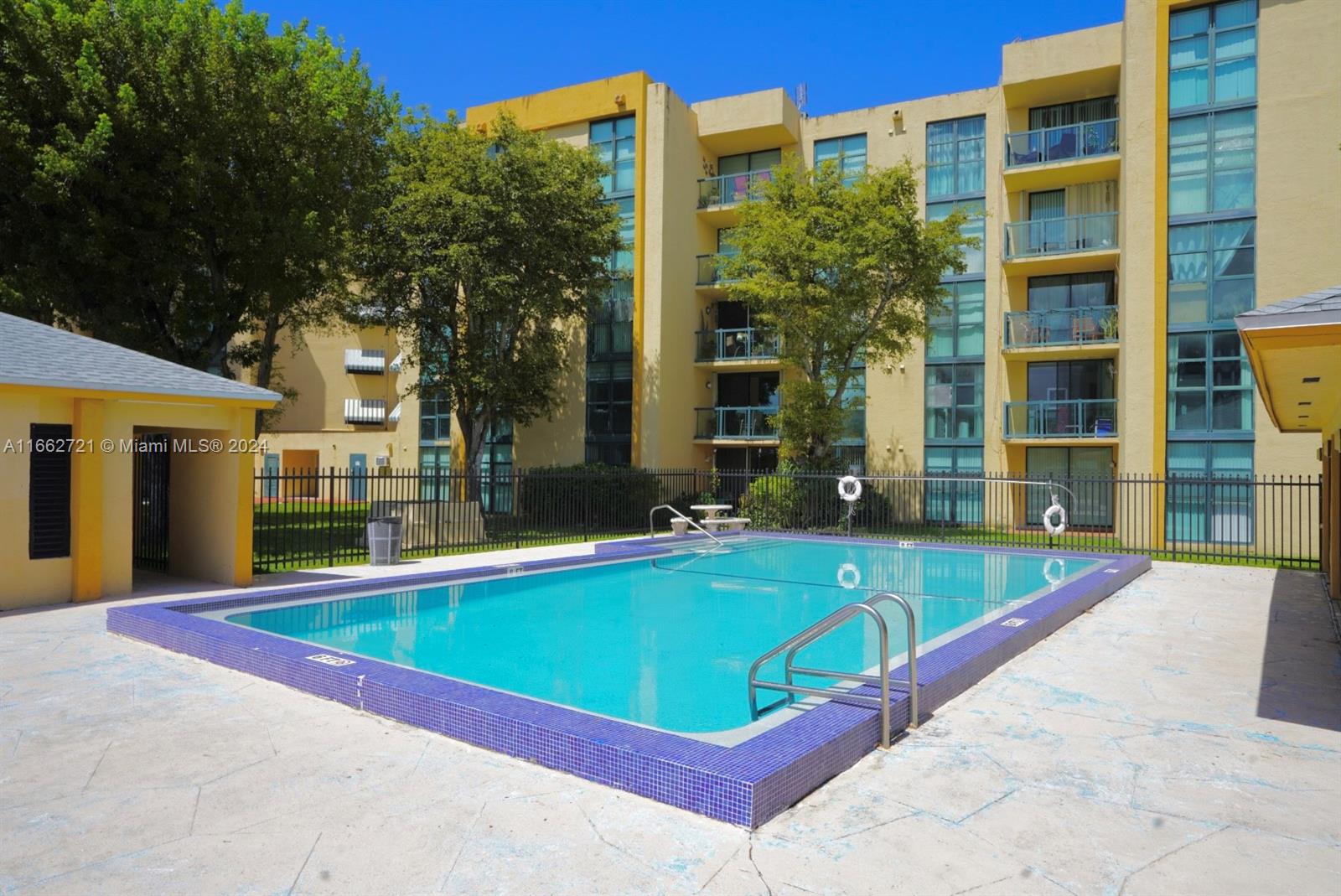 11790 Southwest 18th Street, Unit 2273 Miami, FL 33175 - Photo 4 of 18 a view of a building with a swimming pool