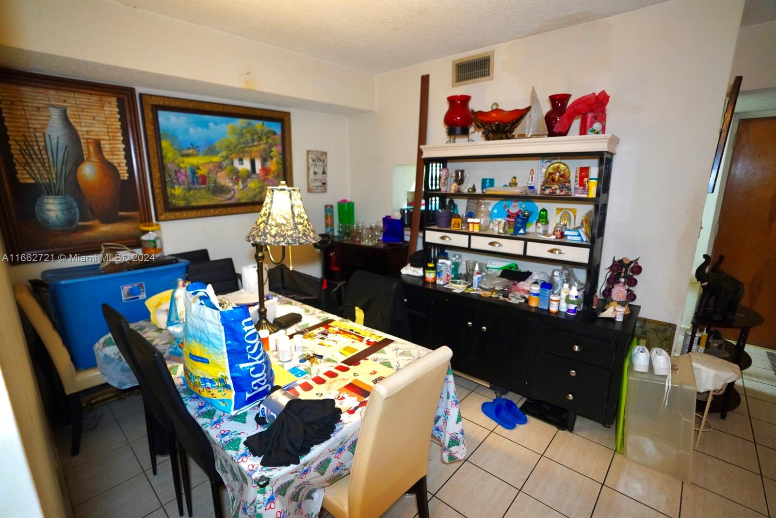 11790 Southwest 18th Street, Unit 2273 Miami, FL 33175 - Photo 6 of 18 a living room with furniture and a flat screen tv