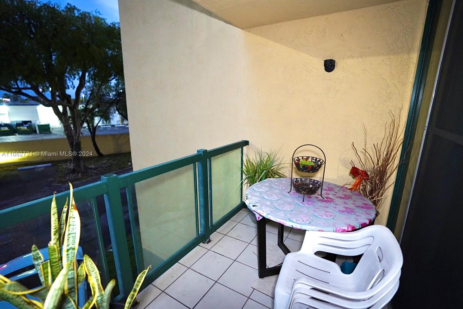 11790 Southwest 18th Street, Unit 2273 Miami, FL 33175 - Photo 9 of 18 a view of balcony with furniture and a potted plant