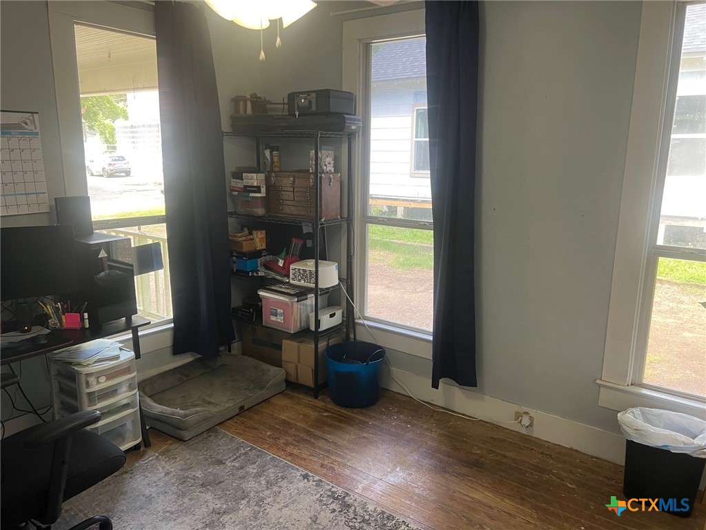 408 Hubbard Street Yoakum, TX 77995 - Photo 12 of 23 a living room with furniture a flat screen tv and a window