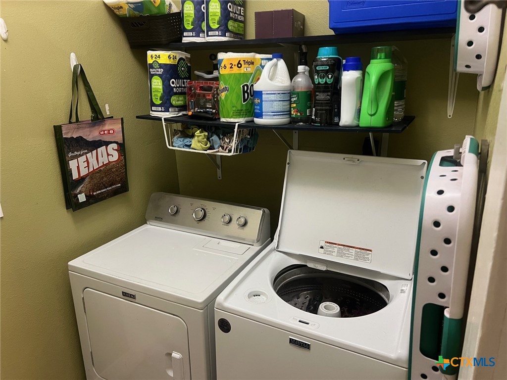 408 Hubbard Street Yoakum, TX 77995 - Photo 17 of 23 a utility room with dryer and washer