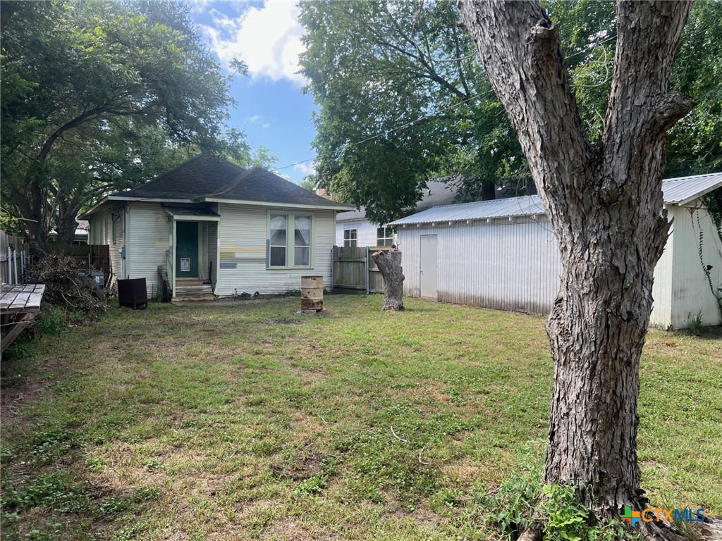 408 Hubbard Street Yoakum, TX 77995 - Photo 18 of 23 a view of a house with a backyard