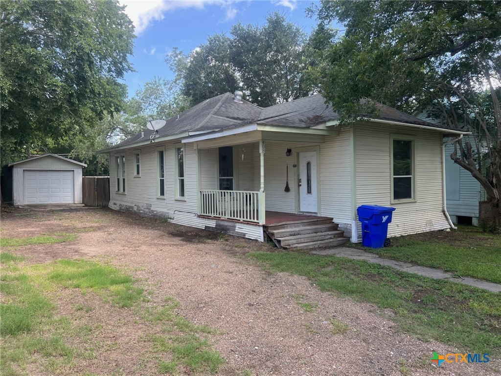 408 Hubbard Street Yoakum, TX 77995 - Photo 2 of 23 a view of a house with a yard and a large tree