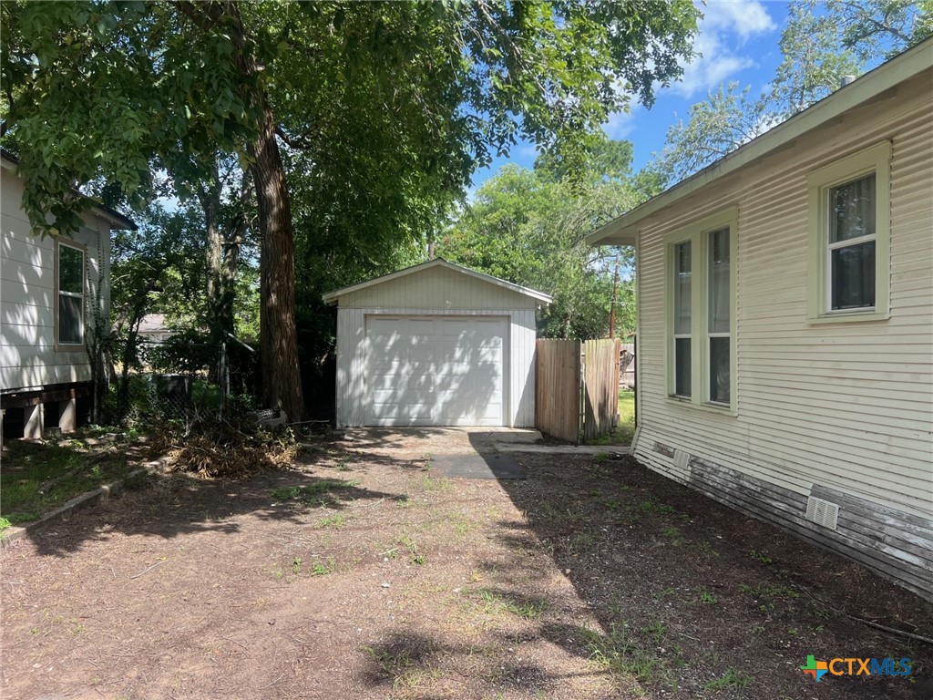 408 Hubbard Street Yoakum, TX 77995 - Photo 23 of 23 a front view of a house with yard and trees