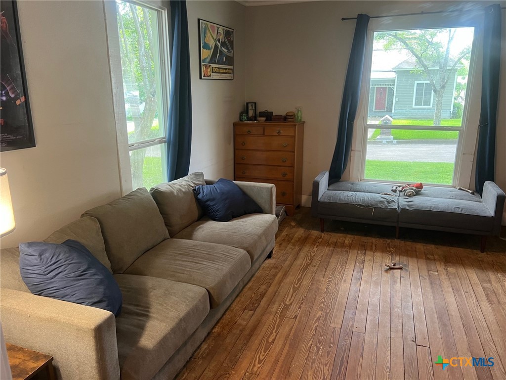 408 Hubbard Street Yoakum, TX 77995 - Photo 5 of 23 a living room with furniture and a large window