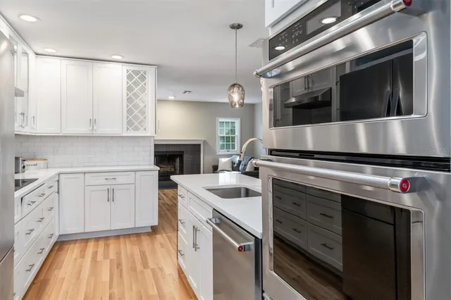 a kitchen with a stove microwave and cabinets